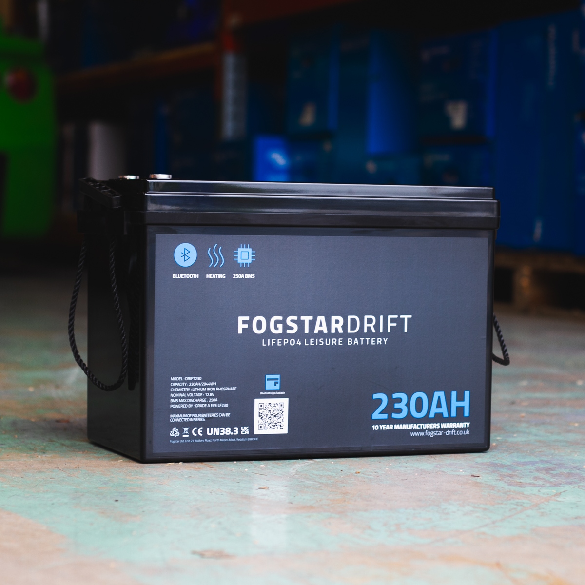 A Fogstar Drift 230Ah - 12V lithium leisure battery with a robust 230Ah capacity is sitting on a warehouse floor.