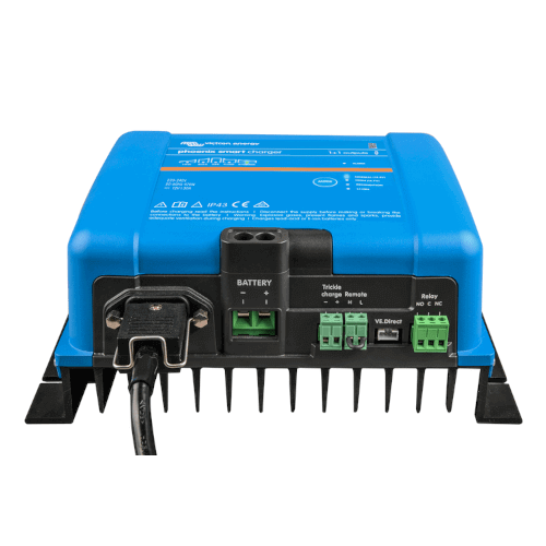 The Victron 24V 25A Phoenix Smart IP43 Charger - 1+1 Outputs is a blue battery charger with multiple green and black connectors and a cooling fan on the bottom, offering 1+1 outputs for added versatility.