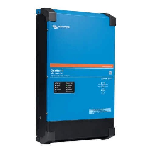 A blue Victron Quattro-II 48/5000/70-50/50 - 48V 5000VA Inverter/Charger is mounted on a wall.