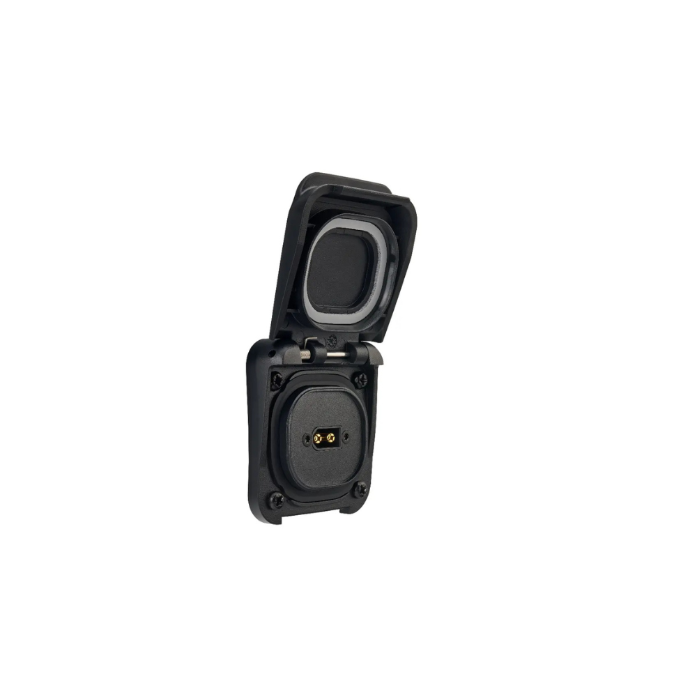 Black wall socket with open protective cover, two prongs, and a ground pin—perfect for use with the Scanstrut Ventura - XT60 Solar Connection system.