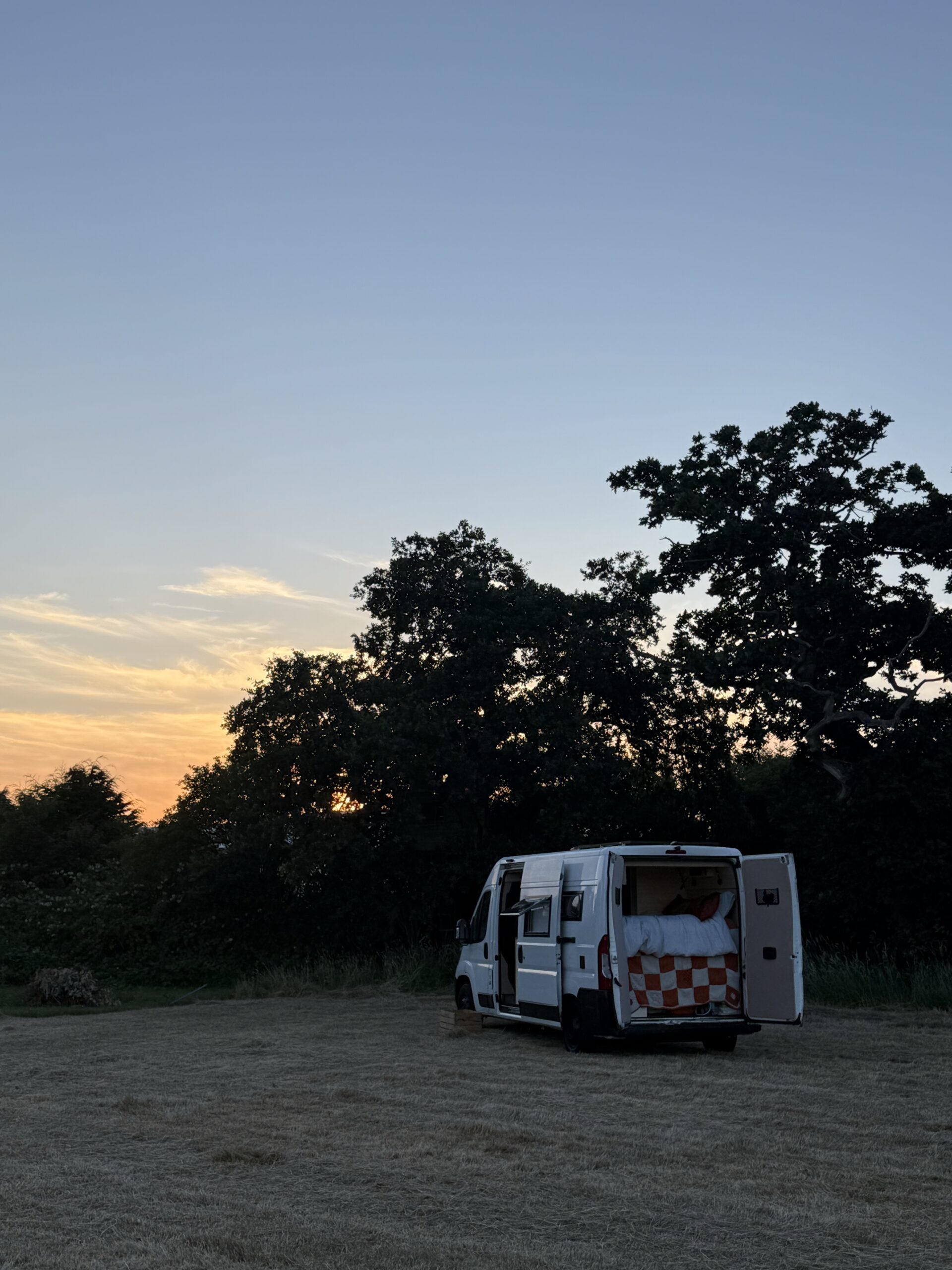 elissa's self converted Campervan hazel in a field