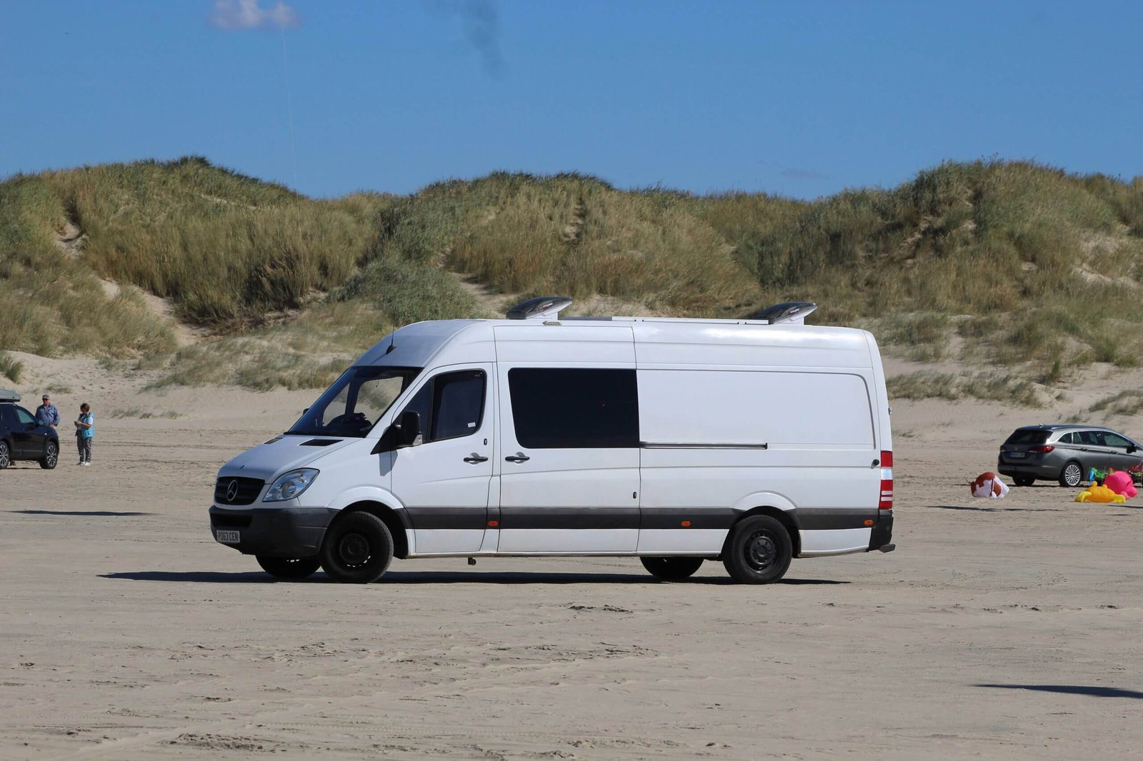Dans' Mercedes Sprinter parked up on a beach in Denmark